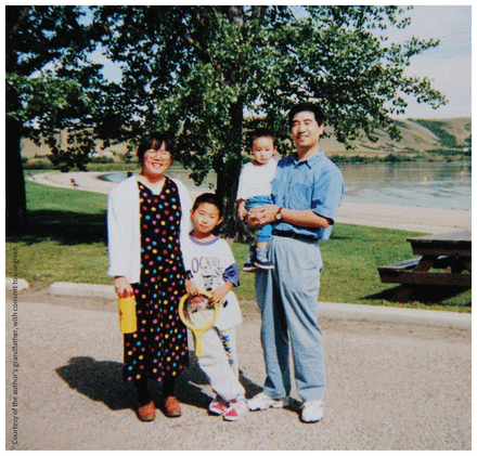 Photo of the Yang Family outdoors at a lake in Regina, Saskatchewan, in the summer of 1996.