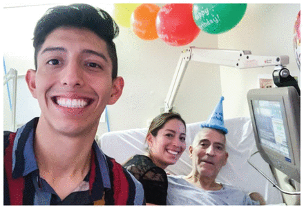 Photo of Fernando Valencia and family celebrating his dad's birthday in hospital.