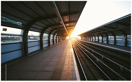 Photo of a deserted platform at a train station.