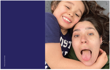 Selfie of Diana Pineda sticking her tongue out while her son hugs her.